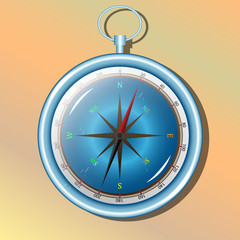 Blue compass for traveler on yellow background