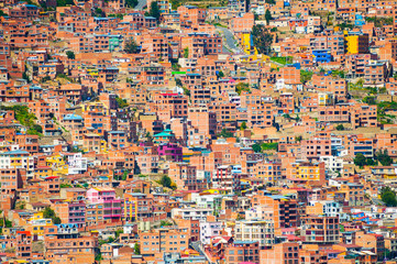Traditional bolivian houses on the hills in La Paz city, Bolivia