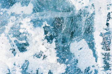 Fototapeta na wymiar Ice on the frozen lake. Macro image, selective focus.