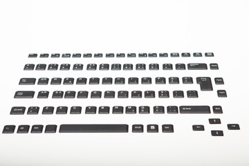 Loose alphanumeric covers for computer keys
