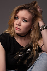 Fashion portrait of a young beautiful girl in the studio