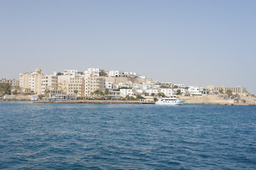 Fototapeta premium Building development on coast of tropical sea ocean