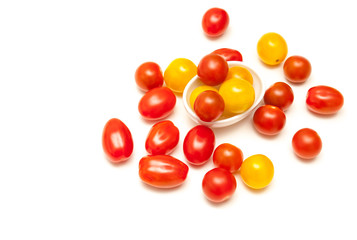 Small tomatoes red and yellow isolated on white background