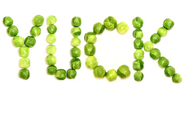 The word 'yuck' is spelled with brussel sprouts to provide a light hearted way of displaying people's opinions towards them and green vegetables in general