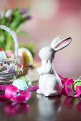 Happy easter. Easter eggs and easter decoration on the wooden table.