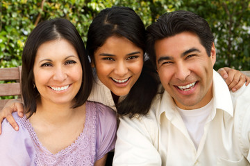 Hispanic family with a teen daughter.