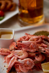 Boiled shrimp with pepper and Lavrushka. With the lemon slices and sauce