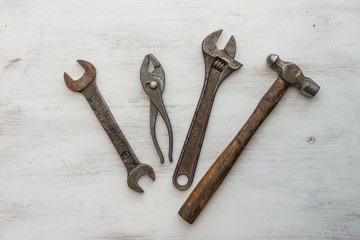 Row of old tools in wooden table