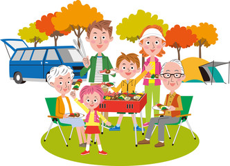 バーベキューを楽しむ二世帯家族　秋