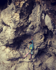 Rock-climbing in Turkey. The climber climbs on the route. Photo from the top.