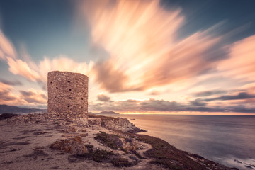 Dramatic sunset at Punta Spanu on the coast of Corsica