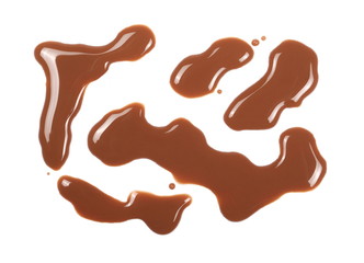 Spilled chocolate milk puddle isolated on white background, top view
