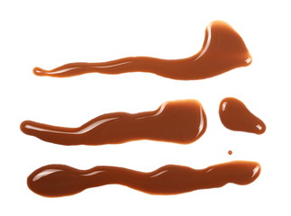 Spilled chocolate milk puddle isolated on white background, top view