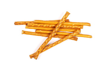 Salty cracker pretzel sticks isolated on white background, top view