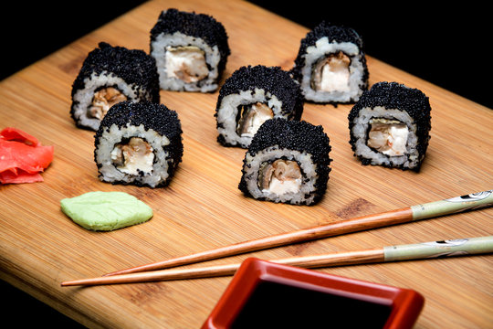 Sushi zuko maki with shrimp, cheese, cucumber and black masago caviar.
