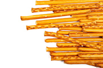 Salty cracker pretzel sticks isolated on white background, top view
