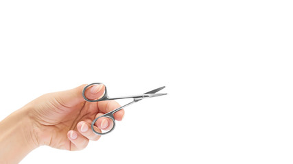 manicure scissors in hand isolated on white background. copy space, template