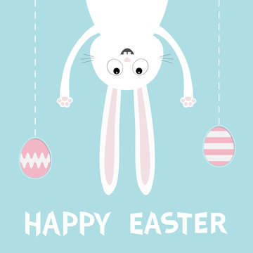 Happy Easter. White bunny rabbit. Funny head face silhouette hanging upside down. Painting egg shell. Dash line thread. Cute cartoon character Baby collection. Flat design Blue background