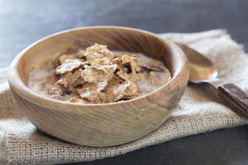 cornflakes in a brown clay plate