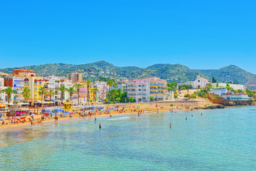 View of the beach and the sea shore of a small resort town Sitge