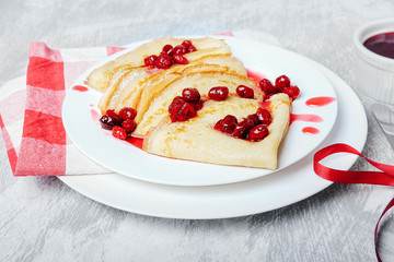 Russian pancakes with cornelian cherry jam.