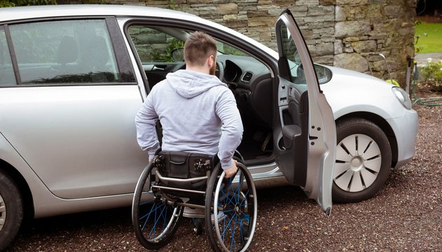 Disabled man boarding in his car