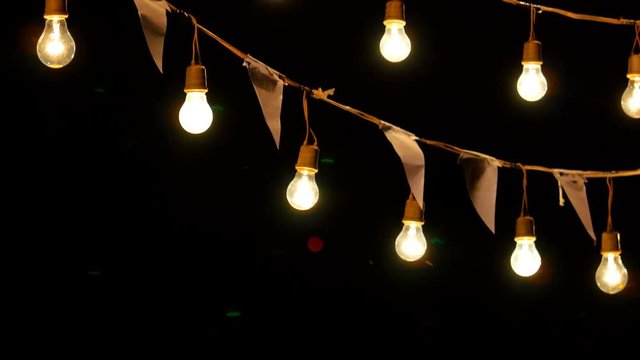 4K Light bulbs garland hanging in the air