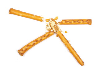Salty cracker pretzel sticks isolated on white background, top view