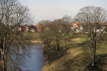 Colorful houses close to moat and ramparts