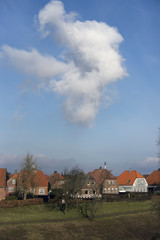 Cloud over colorful houses in Fredericia