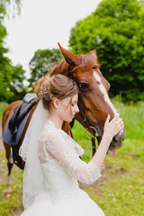 Beautiful young bride with the horse