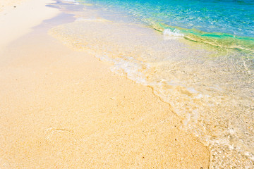 Wave of the sea on the sand beach