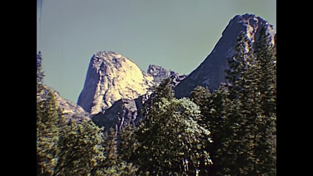 Highway to Yosemite NP. Half Dome in the Yosemite National Park in California state, United States. Vintage Archive footage in circa 1980.