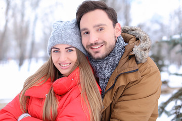 Young couple in park on winter vacation