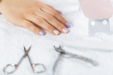 Obraz na płótnie Canvas Woman hands receiving a manicure in beauty salon