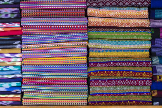 Assortment of colorful sarongs for sale in local market, Yangon, Myanmar, Burma