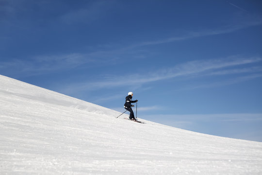 Young woman extremely skiing down the hills at the tyrolean/tirolean Alps.