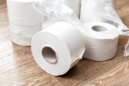 Toilet paper on wood background