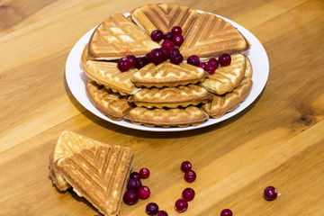 Delicious homemade cookies with berries on a wooden table