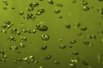 bubbles of different color in the water bright high lights