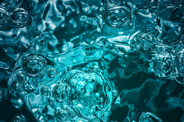 bubbles of different color in the water bright high lights