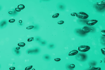 bubbles of different color in the water bright high lights