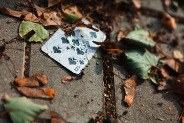 Playing card on the ground
