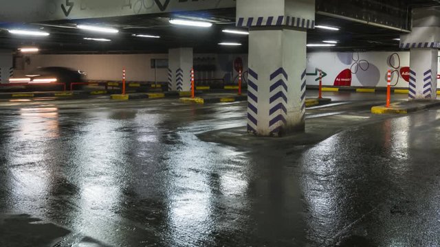 motion of cars at entrance and exit in underground shopping mall parking  time lapse