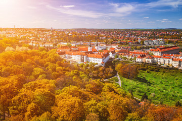 Fototapeta premium Prague, Czezh Republic. Scenic autumn aerial view of the Old Town with red foliage