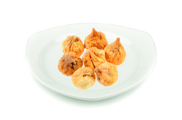 dried fig in white plate on white background