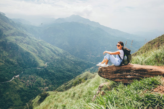 Tourist woman enjoy with beautiful view on mountains in Ella, Sri Lanka