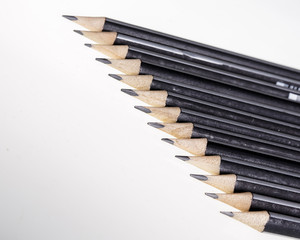 Black pencils on white background.