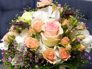 Beautiful flower bunch with roses, gypsophila, violets and leaves, bridal bouquet