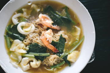 Fried noodle with seafood, broccoli vegetables